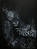 A white charcoal drawing of a leopard resting on textured tree bark, with the animal's face and spotted fur pattern clearly visible against a dark background.